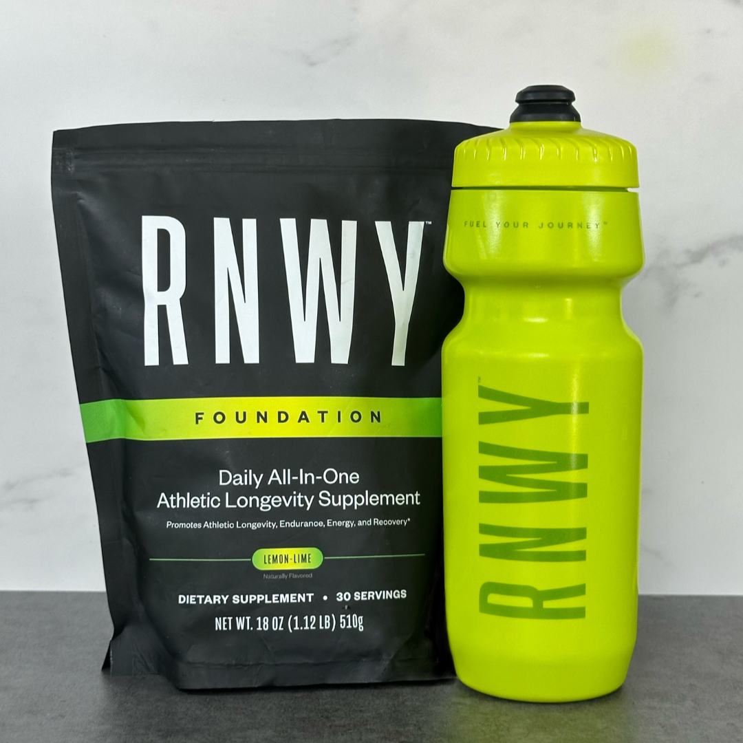 RNWY supplement package and water bottle on a gray surface with a light gray background