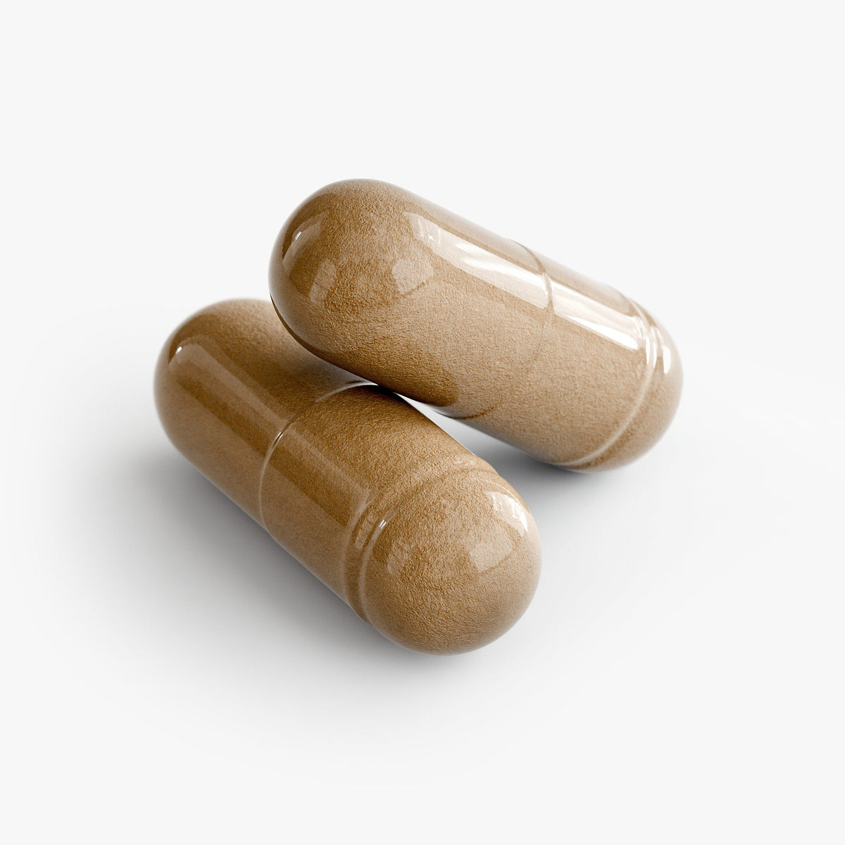 Two brown capsules on a white background