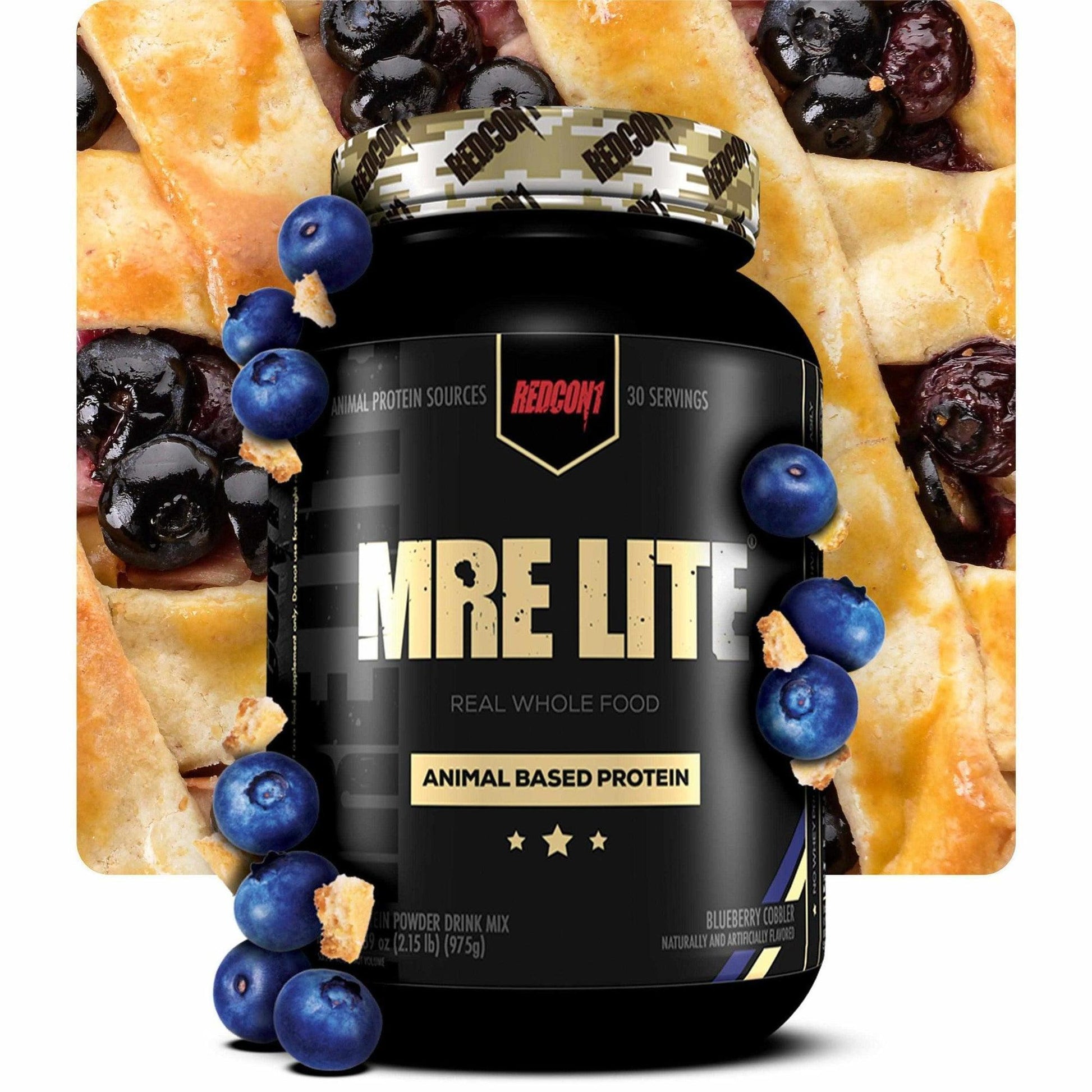 MRE Lite protein supplement bottle with blueberries and a pastry on a white background
